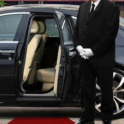 A car service at the kerb, waiting on the booking.